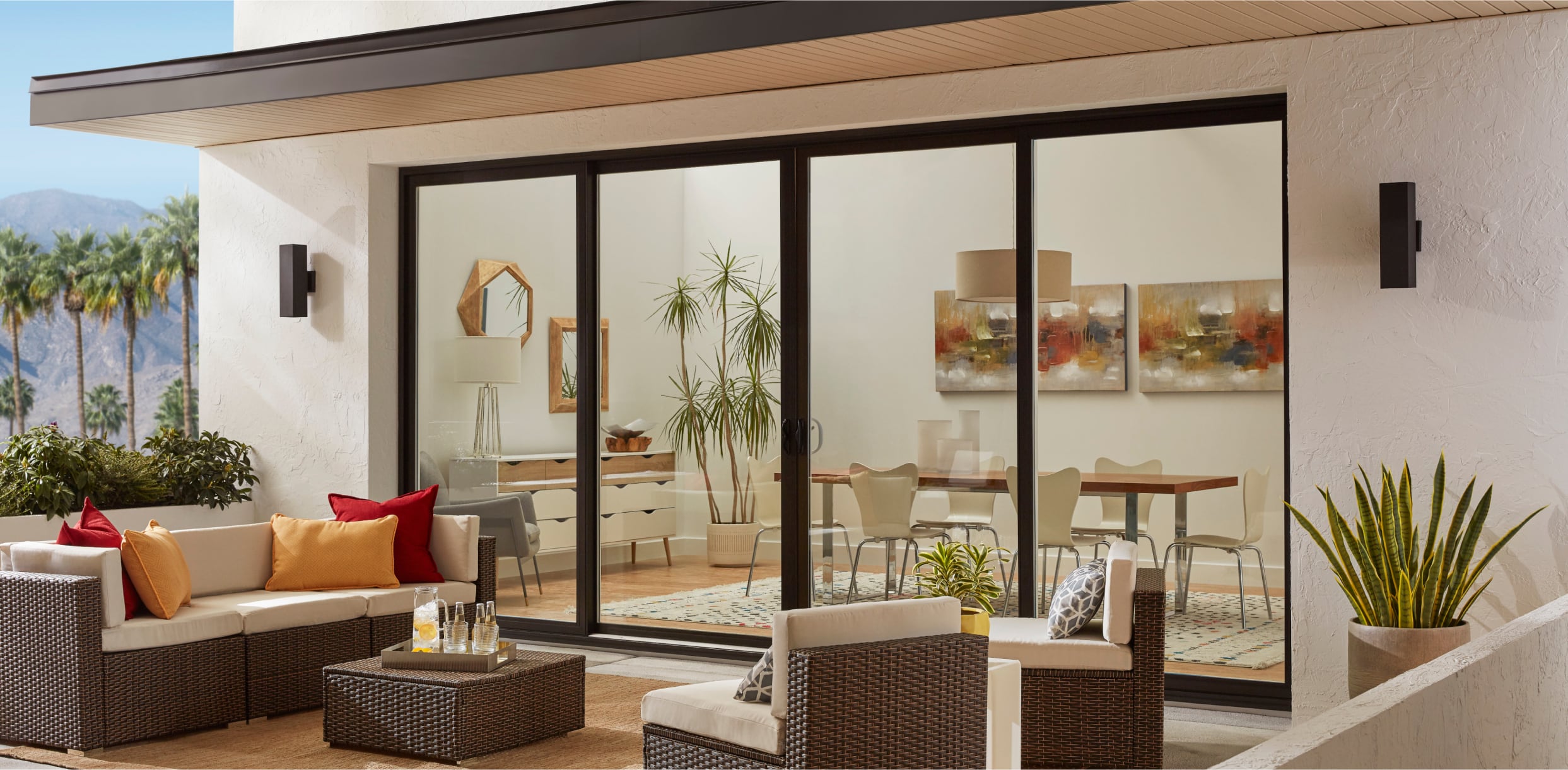 PGW_Exterior_BackPatio_960_SlidingPatioDoors_4Panel_Black_IdeasInspiration_Module_2_1243x610_p311 Exterior View of a Black 960 Bi-Parting Sliding Patio Door