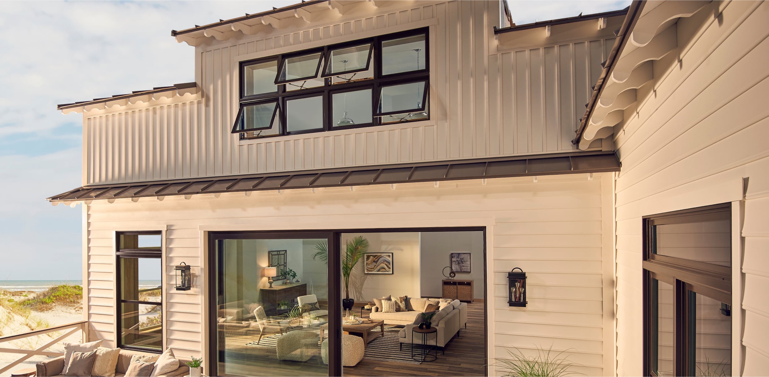 PGW_Exterior_BackPatio_Mira_AwningWindow_Black_IdeasInspiration_Module_1_1243x610_p215 Exterior Black 1500 Series Awning Windows