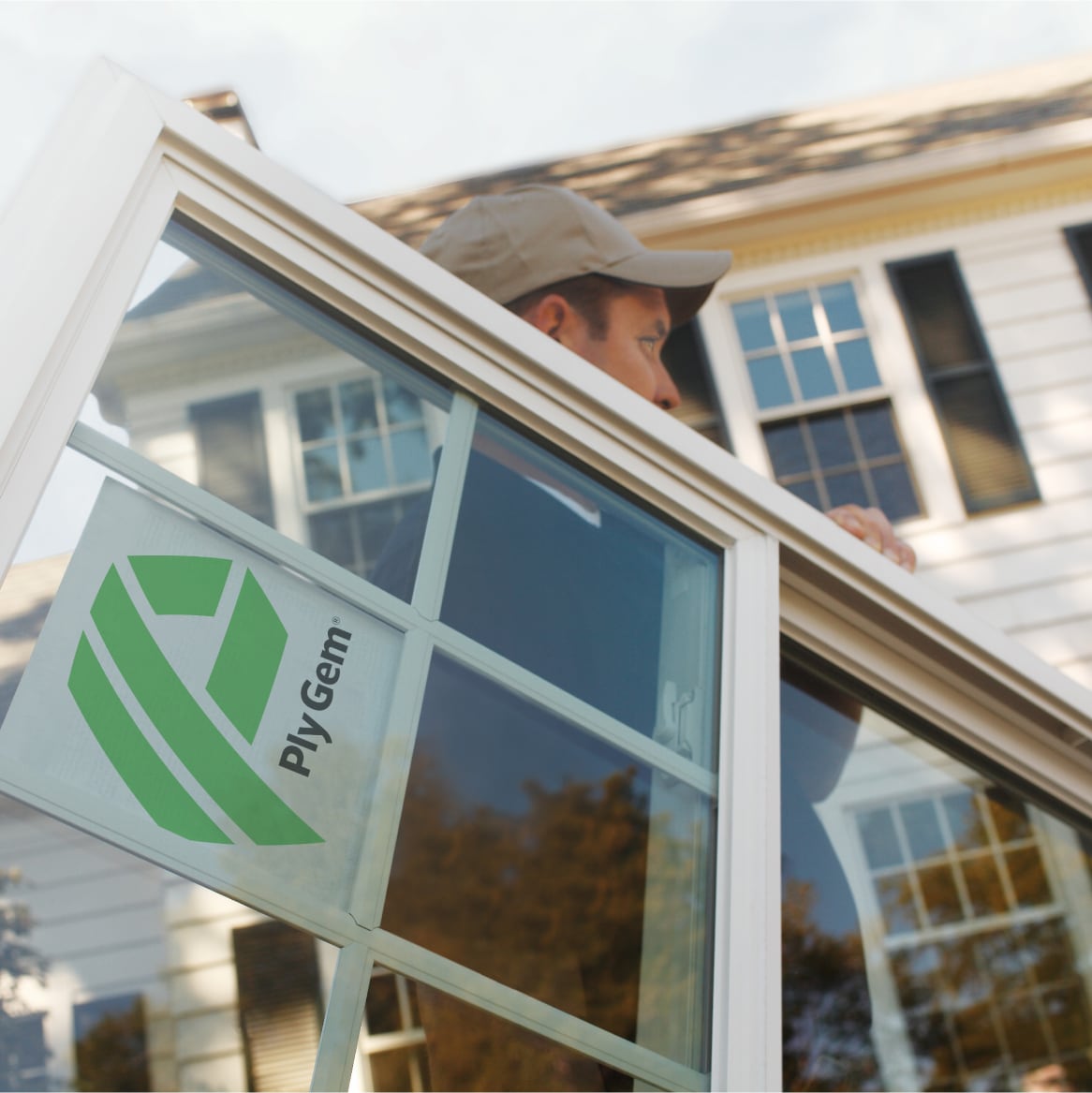 An Installer Carrying a Ply Gem Replacement Window
