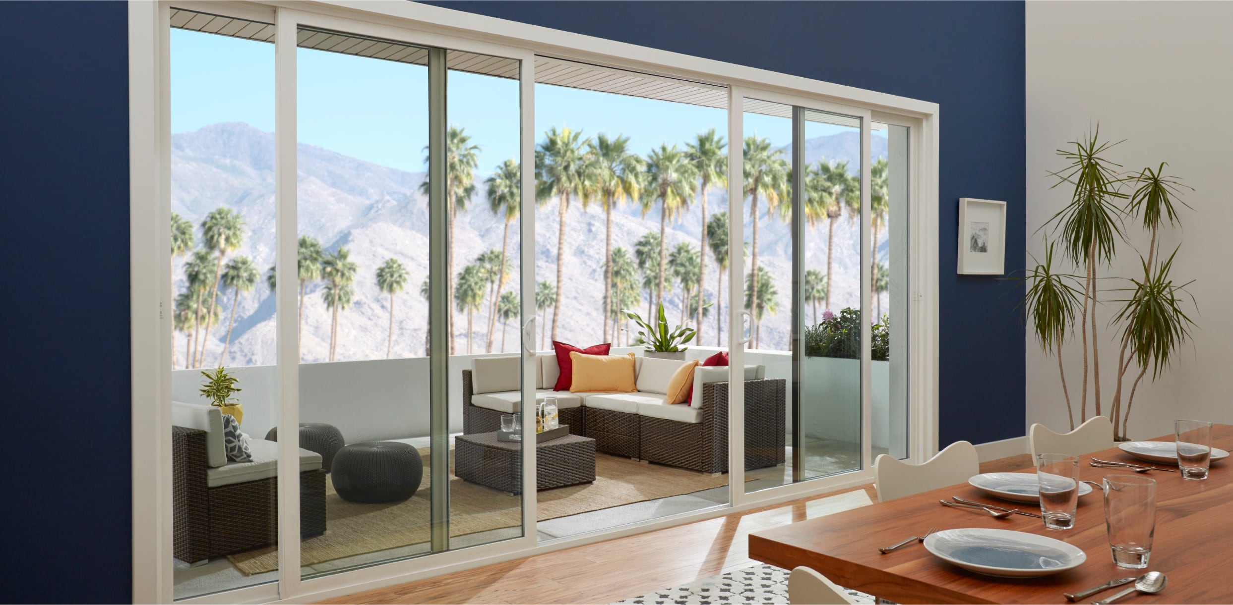 PGW_Interior_DiningRoom_960_SlidingPatioDoors_4Panel_White_IdeasInspiration_Module_3_1243x610_p311 Interior View of a White 960 Bi-Parting Sliding Patio Door Open