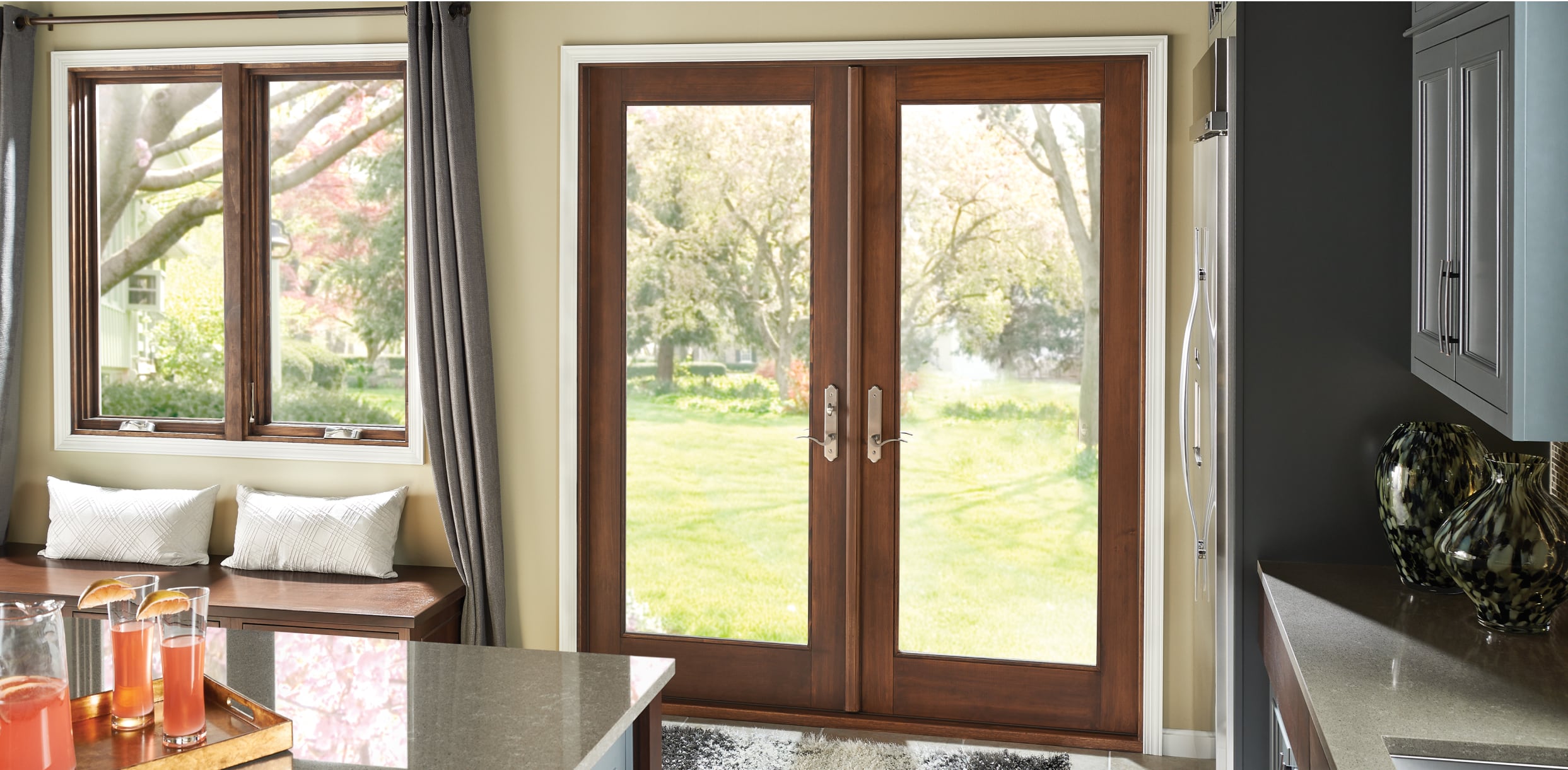 PGW_Interior_Kitchen_MIRA_SwingingDoors_IdeasInspiration_Module_2_1243x610_p314 Stained Woodgrain Out-Swing MIRA Patio Door Interior View