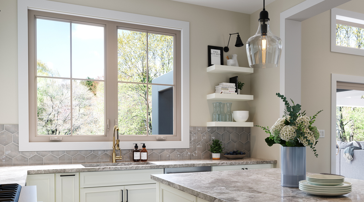 2026 Window and Door Trends: What Homeowners Want in New Homes 3 Tan casement window over the kitchen sink with a multi-point lock.
